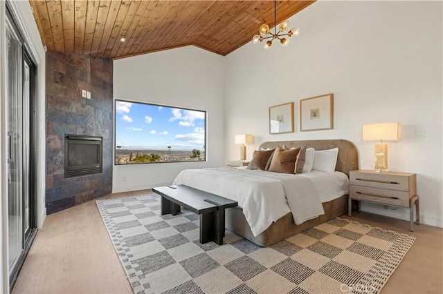 8280 Grand View Dr, Los Angeles, CA 90046 - bedroom featuring wooden ceiling, a fireplace, a chandelier, high vaulted ceiling, and light wood-type flooring