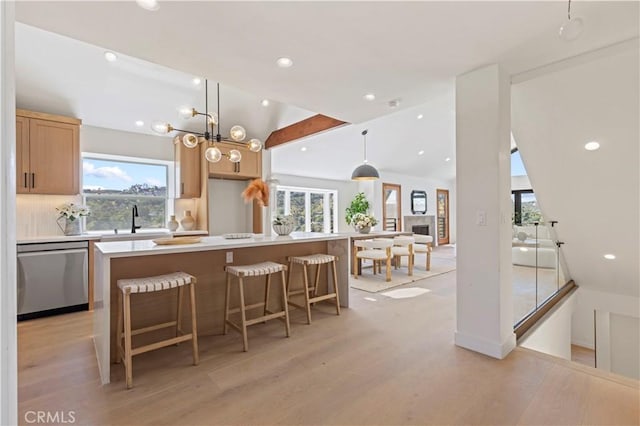 8280 Grand View Dr, Los Angeles, CA 90046 - kitchen with dishwasher, vaulted ceiling, light wood-style flooring, healthy amount of natural light, and recessed lighting