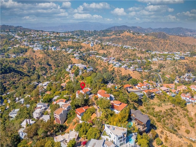 8280 Grand View Dr, Los Angeles, CA 90046 - aerial view of property's location with a mountainous background and nearby suburban area