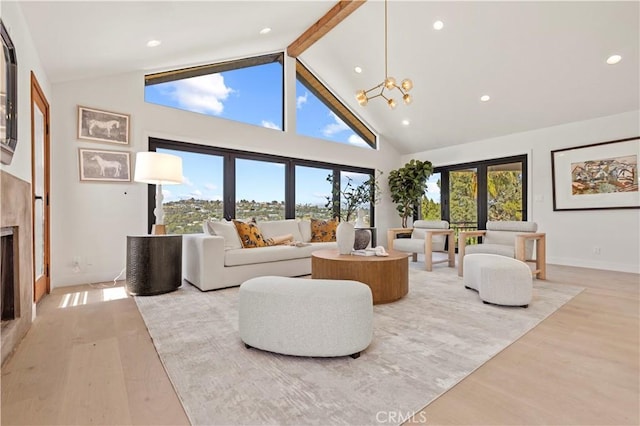 8280 Grand View Dr, Los Angeles, CA 90046 - living area featuring light wood finished floors, a chandelier, beamed ceiling, high vaulted ceiling, and recessed lighting