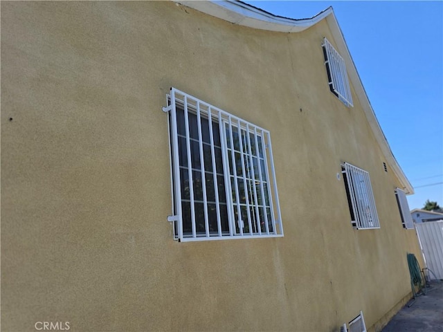 123 E Gage Ave, Los Angeles, CA 90003 - view of side of home with stucco siding