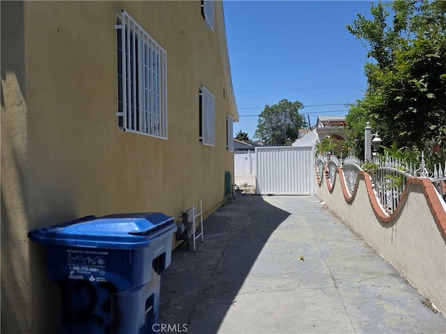 123 E Gage Ave, Los Angeles, CA 90003 - view of side of home featuring stucco siding