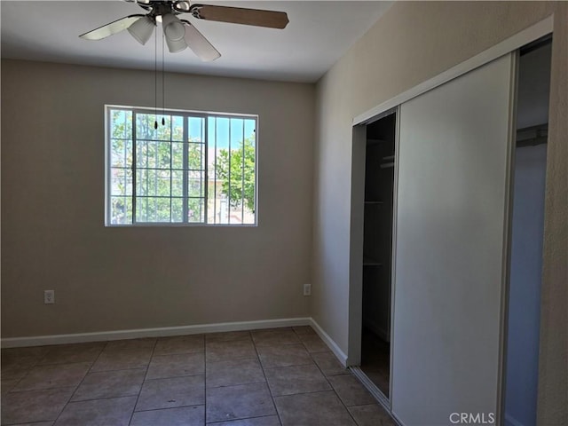 123 E Gage Ave, Los Angeles, CA 90003 - unfurnished bedroom featuring a closet, tile patterned flooring, and a ceiling fan