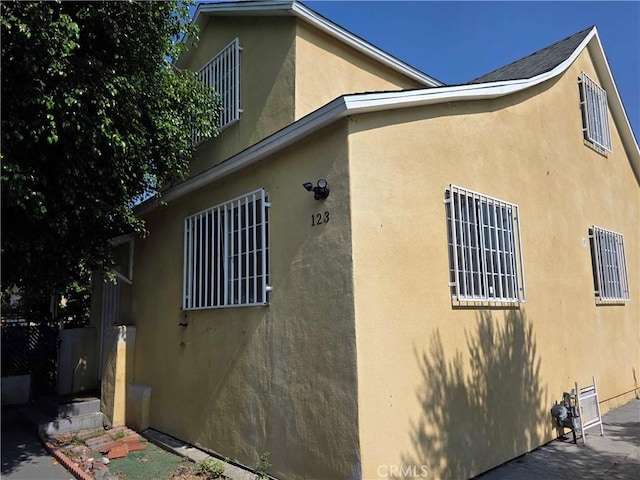 123 E Gage Ave, Los Angeles, CA 90003 - view of property exterior with stucco siding