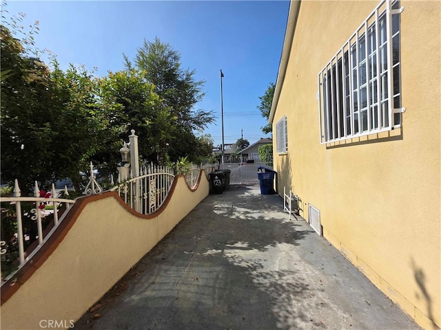 123 E Gage Ave, Los Angeles, CA 90003 - view of home's exterior with stucco siding
