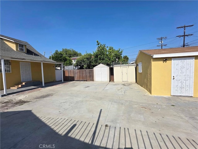 123 E Gage Ave, Los Angeles, CA 90003 - view of patio with a shed