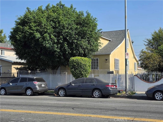 123 E Gage Ave, Los Angeles, CA 90003 - view of front of property with roof with shingles and stucco siding