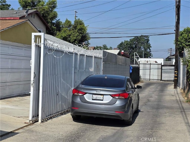 123 E Gage Ave, Los Angeles, CA 90003 - view of parking with a gate