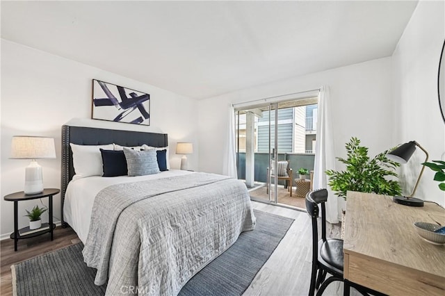 628 Daisy Ave Unit 316, Long Beach, CA 90802 - bedroom featuring wood finished floors and access to exterior