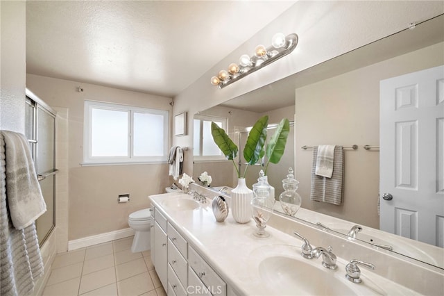 18452 Tamarind St, Fountain Valley, CA 92708 - full bathroom with double vanity, tile patterned flooring, and shower / bath combination with glass door