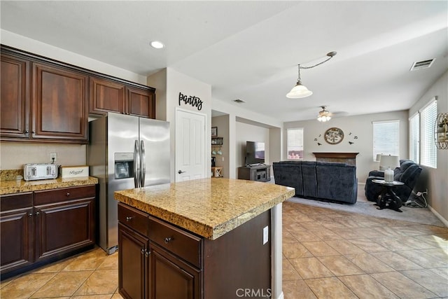 31258 Shadow Ridge Dr, Menifee, CA 92584 - kitchen with stainless steel refrigerator with ice dispenser, ceiling fan, a center island, and dark brown cabinets