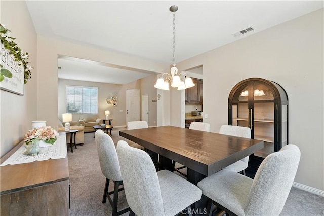31258 Shadow Ridge Dr, Menifee, CA 92584 - dining space with carpet floors and a chandelier