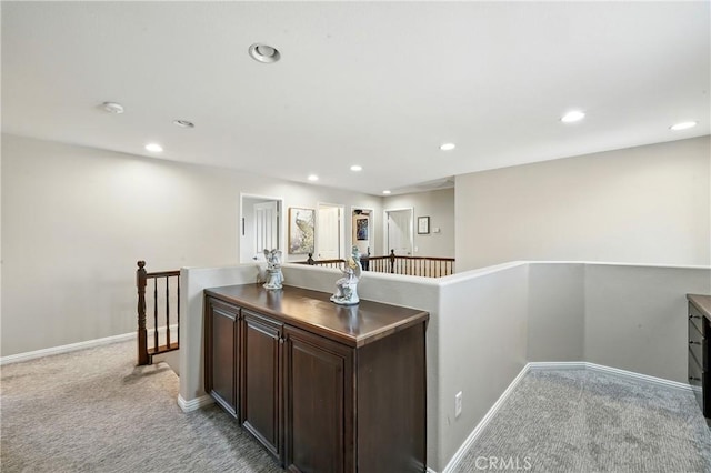 31258 Shadow Ridge Dr, Menifee, CA 92584 - kitchen with light carpet, recessed lighting, and dark brown cabinetry