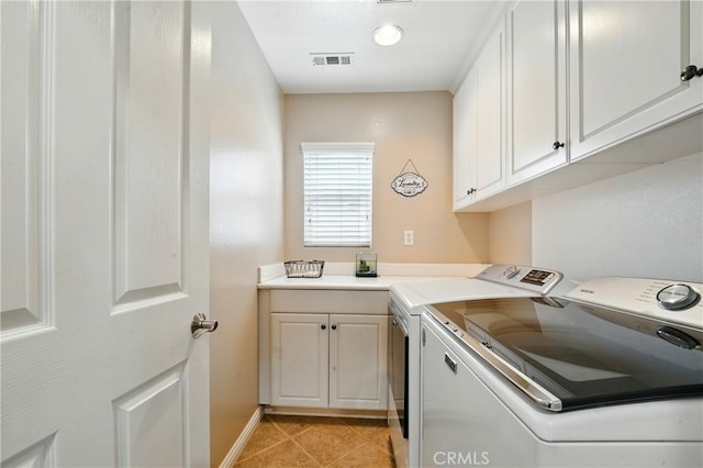 31258 Shadow Ridge Dr, Menifee, CA 92584 - washroom featuring independent washer and dryer, cabinet space, and light tile patterned floors