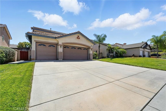 31258 Shadow Ridge Dr, Menifee, CA 92584 - mediterranean / spanish home featuring stucco siding, a garage, driveway, a front lawn, and a tiled roof