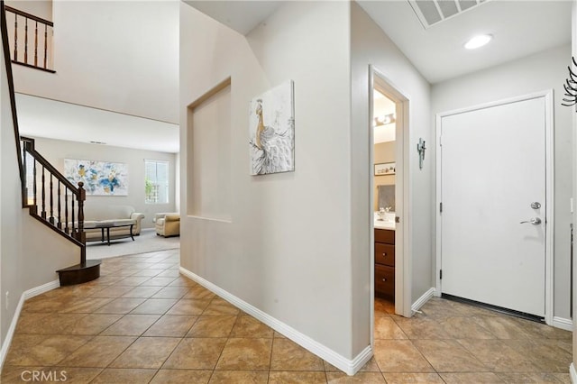 31258 Shadow Ridge Dr, Menifee, CA 92584 - foyer with stairs, light tile patterned flooring, and recessed lighting