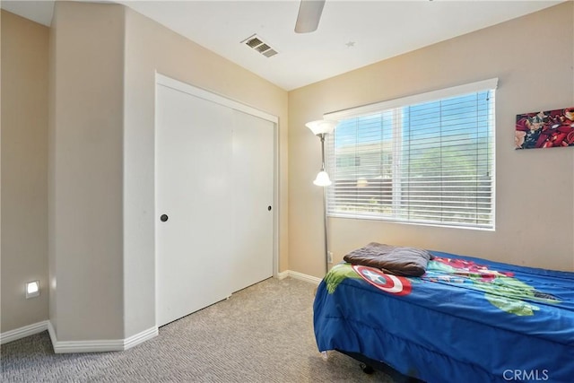 31258 Shadow Ridge Dr, Menifee, CA 92584 - carpeted bedroom with multiple windows, ceiling fan, and a closet