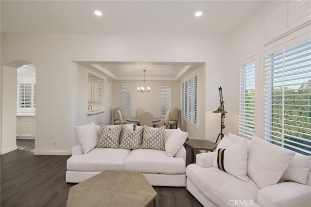 3120 Tara, Costa Mesa, CA 92626 - living room featuring dark wood finished floors, arched walkways, a chandelier, a tray ceiling, and recessed lighting