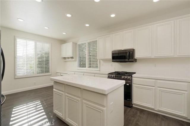 3120 Tara, Costa Mesa, CA 92626 - kitchen with appliances with stainless steel finishes, tile counters, recessed lighting, white cabinets, and dark wood-style floors