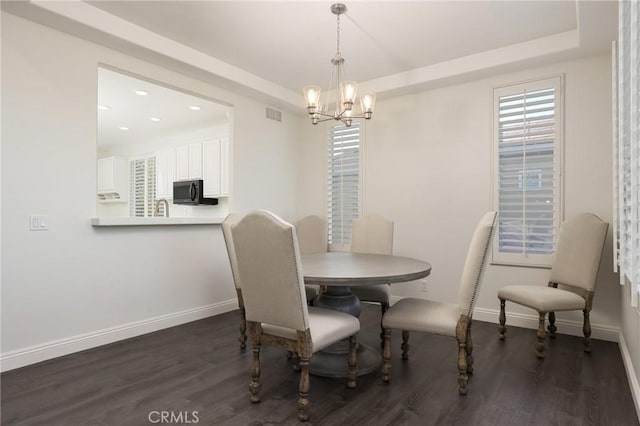 3120 Tara, Costa Mesa, CA 92626 - dining room with dark wood finished floors, a chandelier, recessed lighting, and a raised ceiling