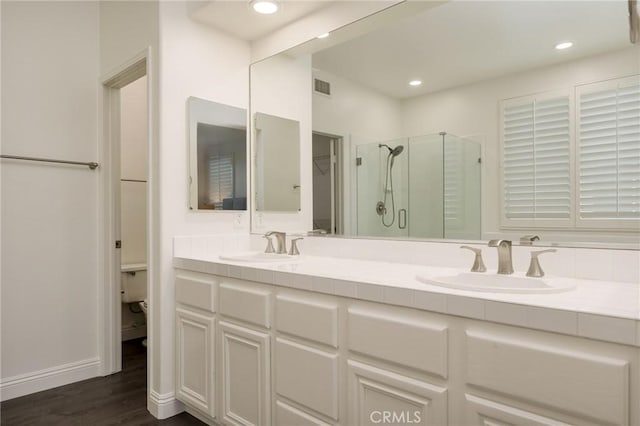 3120 Tara, Costa Mesa, CA 92626 - full bathroom featuring a stall shower, double vanity, wood finished floors, and recessed lighting