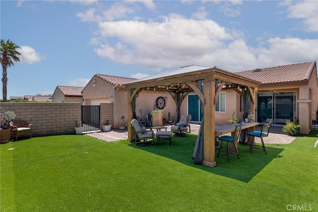 67760 Rio Vista Dr, Cathedral City, CA 92234 - back of house featuring stucco siding, a gazebo, a tile roof, and a gate