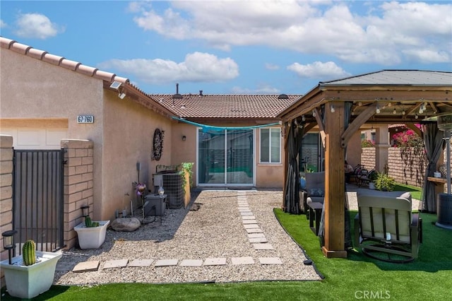 67760 Rio Vista Dr, Cathedral City, CA 92234 - rear view of property with stucco siding, a gazebo, and a tiled roof