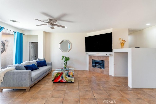 67760 Rio Vista Dr, Cathedral City, CA 92234 - living area featuring a ceiling fan, a tiled fireplace, tile patterned floors, and recessed lighting