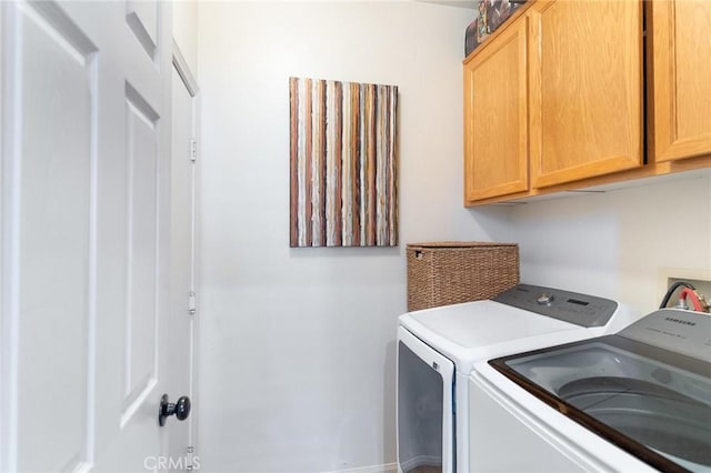 67760 Rio Vista Dr, Cathedral City, CA 92234 - washroom with independent washer and dryer and cabinet space