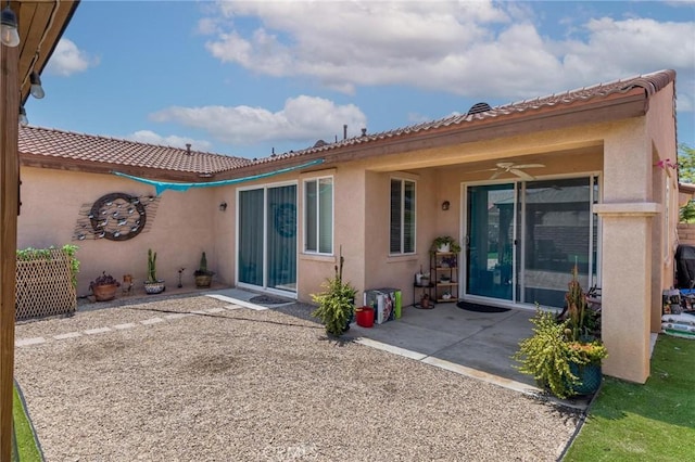 67760 Rio Vista Dr, Cathedral City, CA 92234 - back of house with stucco siding, a patio area, ceiling fan, and a tiled roof