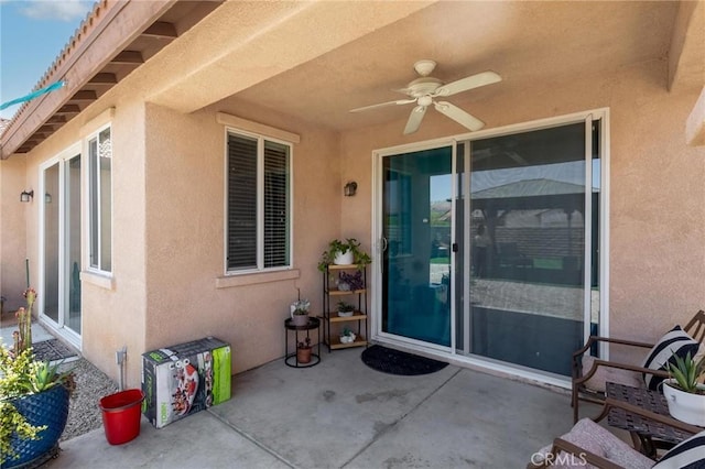 67760 Rio Vista Dr, Cathedral City, CA 92234 - view of exterior entry with a patio, ceiling fan, and stucco siding