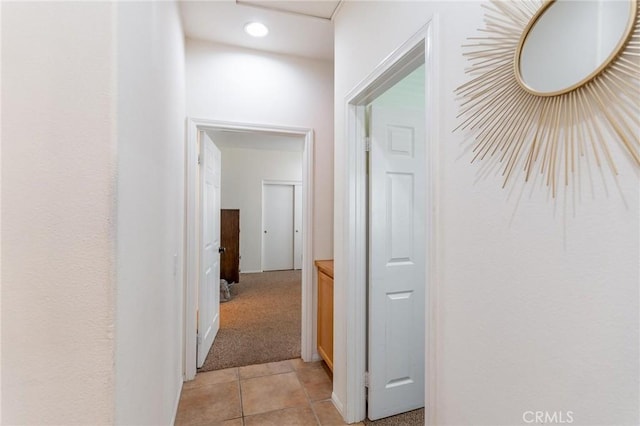 67760 Rio Vista Dr, Cathedral City, CA 92234 - corridor with light tile patterned floors, recessed lighting, and light colored carpet