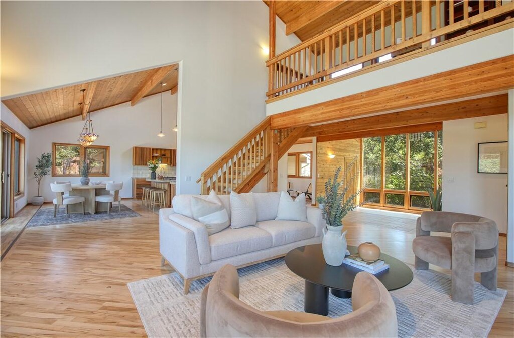 1655 Chesapeake Pl, Arroyo Grande, CA 93420 - living area featuring wood finished floors, stairway, a wooden ceiling with exposed beams, and high vaulted ceiling