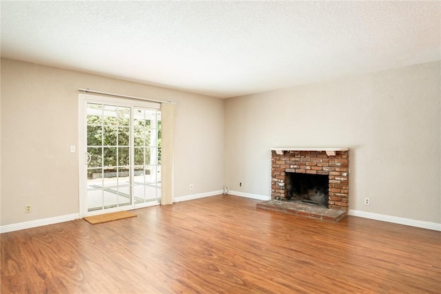 131 N Dommer Ave, Walnut, CA 91789 - unfurnished living room featuring wood finished floors and a fireplace