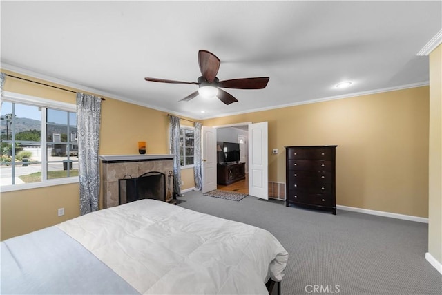 644 E Mountain View Ave, Glendora, CA 91741 - carpeted bedroom featuring ornamental molding, a ceiling fan, and a fireplace
