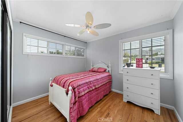644 E Mountain View Ave, Glendora, CA 91741 - bedroom with multiple windows, light wood finished floors, crown molding, and ceiling fan