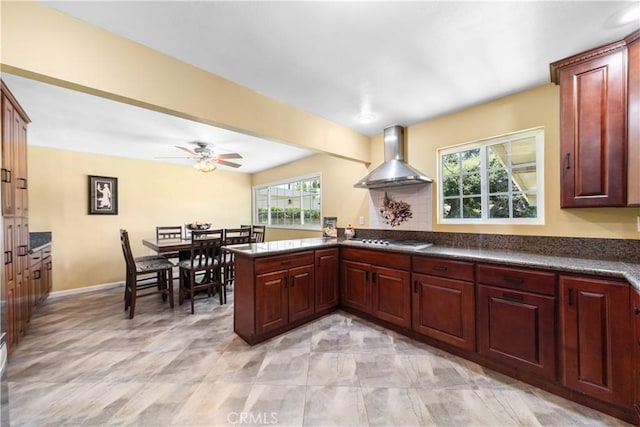 644 E Mountain View Ave, Glendora, CA 91741 - kitchen featuring wall chimney range hood, dark countertops, stainless steel stovetop, and a peninsula