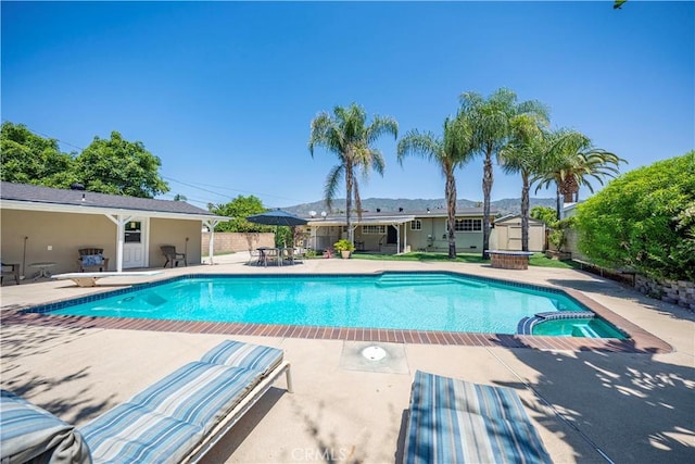644 E Mountain View Ave, Glendora, CA 91741 - view of pool featuring a shed, a patio, and a pool with connected hot tub
