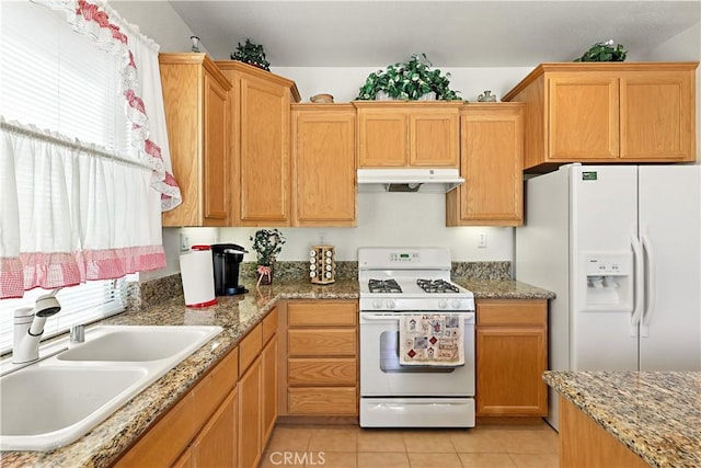 9790 Heatherhearst Dr, Chowchilla, CA 93610 - kitchen featuring white appliances, under cabinet range hood, light tile patterned floors, and light stone countertops