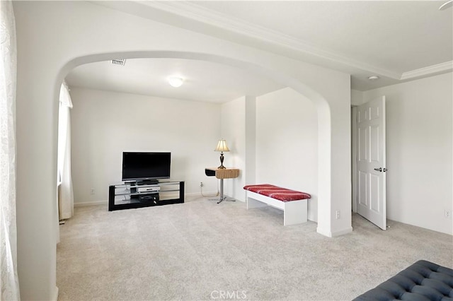 9790 Heatherhearst Dr, Chowchilla, CA 93610 - living area featuring arched walkways, carpet, and ornamental molding