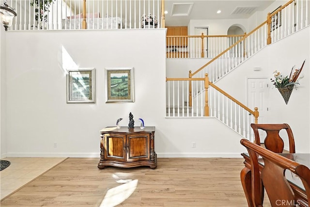 9790 Heatherhearst Dr, Chowchilla, CA 93610 - stairs with wood finished floors, recessed lighting, and a towering ceiling