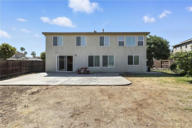 9790 Heatherhearst Dr, Chowchilla, CA 93610 - back of house featuring a patio area, a fenced backyard, and stucco siding