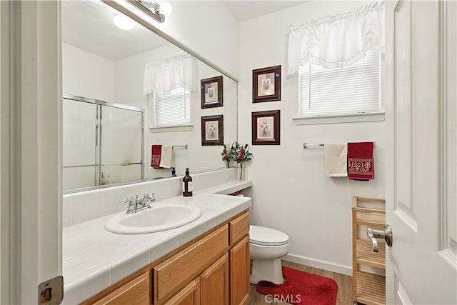 9790 Heatherhearst Dr, Chowchilla, CA 93610 - bathroom with vanity, a shower with shower door, and wood finished floors