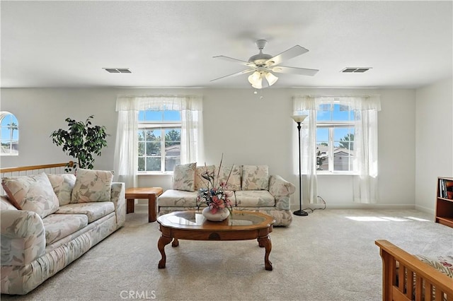 9790 Heatherhearst Dr, Chowchilla, CA 93610 - carpeted living room featuring healthy amount of natural light and a ceiling fan