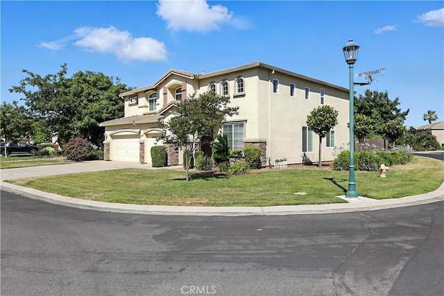 9790 Heatherhearst Dr, Chowchilla, CA 93610 - mediterranean / spanish-style house featuring stucco siding, driveway, a garage, and a front yard