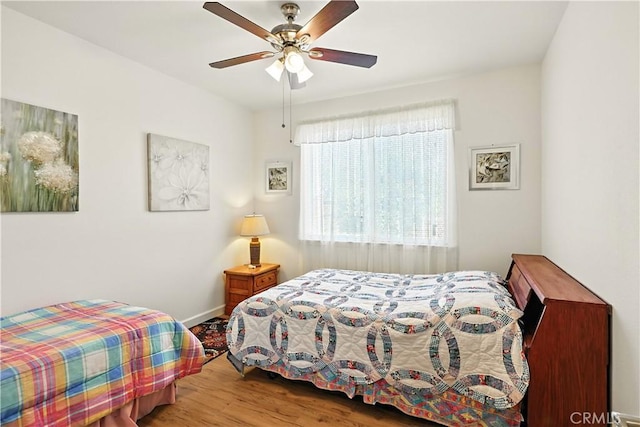 9790 Heatherhearst Dr, Chowchilla, CA 93610 - bedroom with wood finished floors and a ceiling fan