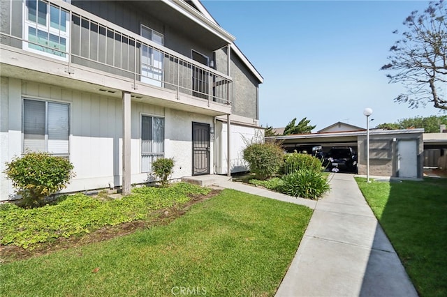 2827 S Fairview St Unit O, Santa Ana, CA 92704 - view of building exterior featuring a carport