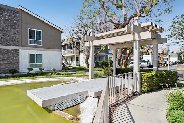 2827 S Fairview St Unit O, Santa Ana, CA 92704 - surrounding community with a pergola and stairs