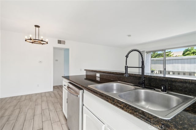 2827 S Fairview St Unit O, Santa Ana, CA 92704 - kitchen featuring stainless steel dishwasher, white cabinetry, a chandelier, pendant lighting, and light wood-style floors