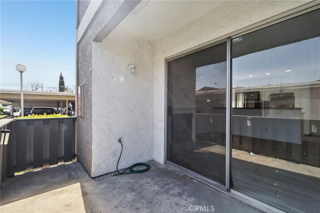 2827 S Fairview St Unit O, Santa Ana, CA 92704 - doorway to property with stucco siding